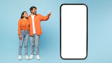 Fototapeta  - Smartphone mockup with couple pointing to side