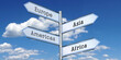 Europe, Asia, Americas, Africa - metal signpost with four arrows