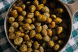 a cup of capers, also called caperberries, an ingredient in many cuisines