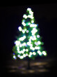 Bokeh Christmas tree and lights at night