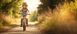 A young child joyfully pedaling his bicycle through the park on a sunny summer day, his helmet ensuring safety as he embraces the thrill of riding.