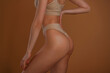 © standret - Close up view. Woman with slim body shape is posing against background