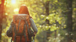 Young woman hiking and going camping in nature. Person with backpack walking in the forest. Copy space, banner concept.
