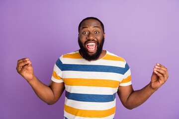 Wall Mural - Photo of funky impressed man wear striped t-shirt holding arms emtpy space isolated violet color background