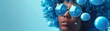 A futuristic woman with a creative blue bubble hairstyle and matching sunglasses poses artistically.