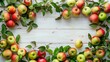 Many healthy and colorful apples lie on a textured light background