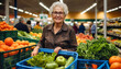 Elderly 75 year old Caucasian woman smiles while shopping at the supermarket with the trolley in the fruit section.
