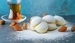 Delicate Eid Sweets with Tea- Celebratory Maamoul Cookies and Powdered Sugar on Kahk 