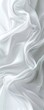 Abstract white satin fabric, smooth elegant textile waves, vertical banner with copy space