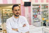 Fototapeta Panele - Portrait of male pharmacist at the modern pharmacy, drugstore.