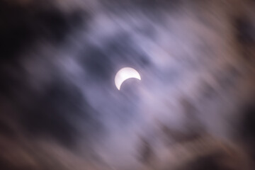 Eclipse abstract moving clouds closing sun copy space background image