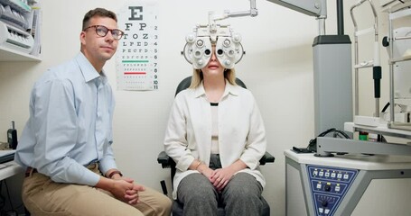 Poster - Ophthalmologist, man and woman in eye exam on phoropter for vision, healthcare or wellness in consultation. Medical test, optometry and patient on machine for eyesight or check with doctor in clinic