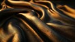 Smooth gold surface against black rough fabric, side lighting, close-up, textural depth