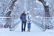 Happy senior couple walking at winter outdoors