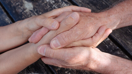 Wall Mural - Old people holding hands close up view, senior retired family couple express care, friendship, psychological support concept, trust in happy marriage, empathy hope