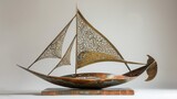 Fototapeta  - Elegant Wooden Sailboat Model with Intricate Metal Sails, Perfect for Nautical Decor