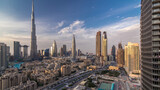 Fototapeta Miasto - Dubai Downtown skyline day to night timelapse with Burj Khalifa and other towers paniramic view from the top in Dubai