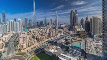 Wall Mural - Dubai Downtown skyline timelapse with Burj Khalifa and other towers panoramic view from the top in Dubai