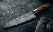 Japanese chefs knife made of damascus steel with a sharp blade and intricate pattern on the blade There is an elegant wooden han