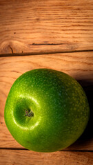 tasty organic green juicy green apples on a rustic wooden background