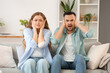 © Pixel-Shot - Young couple suffering from loud neighbours at home