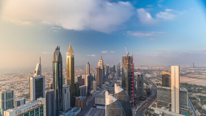 Wall Mural - Skyline view of the buildings of Sheikh Zayed Road and DIFC aerial timelapse in Dubai, UAE.
