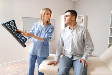 Poster - Female doctor and man with brain concussion examining MRI scan in clinic