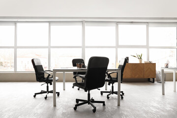 Sticker - Interior of modern conference hall with window, chest of drawers, table and armchairs