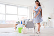 © Pixel-Shot - Young pregnant woman mopping floor at home