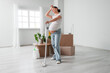 © Pixel-Shot - Tired pregnant woman with vacuum cleaning in new apartment