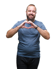 Sticker - Young caucasian hipster man over isolated background smiling in love showing heart symbol and shape with hands. Romantic concept.