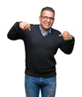 © Krakenimages.com - Middle age bussines arab man wearing glasses over isolated background looking confident with smile on face, pointing oneself with fingers proud and happy.