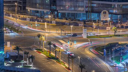 Poster - Top view city traffic on a crossroad in Dubai Business bay night timelapse.