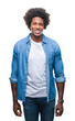 © Krakenimages.com - Afro american man over isolated background with a happy and cool smile on face. Lucky person.