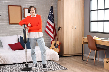 Poster - Female student with vacuum cleaner in bedroom