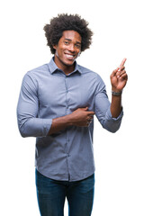 Poster - Afro american man over isolated background with a big smile on face, pointing with hand and finger to the side looking at the camera.