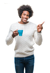 Canvas Print - Afro american man drinking cup of coffee over isolated background very happy pointing with hand and finger to the side