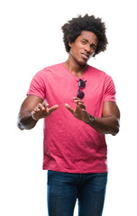 Poster - Afro american man over isolated background disgusted expression, displeased and fearful doing disgust face because aversion reaction. With hands raised. Annoying concept.