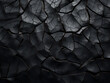 Background-ready black texture featuring cracks for versatile use