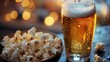 View of a cold glass of beer with condensation droplets, accompanied by a bowl of freshly popped popcorn, perfect for a relaxing evening