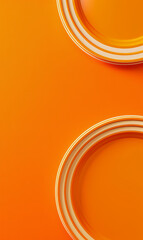 Wall Mural - Bright orange background with the edge of a white circular plates.