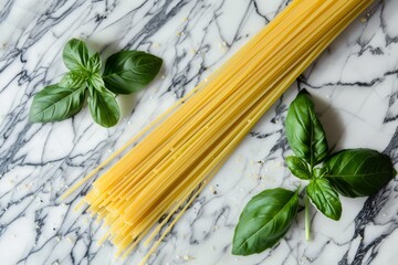 Wall Mural - Close-up view of four strands of spaghetti pasta with fresh basil leaves on a smooth marble surface