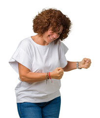 Sticker - Beautiful middle ager senior woman wearing white t-shirt over isolated background excited for success with arms raised celebrating victory smiling. Winner concept.