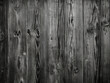 Background showcases an aged wooden texture in black and white