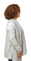 Wall Mural - Beautiful middle ager senior woman wearing jacket and glasses over isolated background looking to side, relax profile pose with natural face with confident smile.