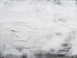 Background with abstract texture featuring white washed paint and brush strokes in gray and black