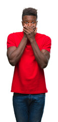 Poster - Young african american man over isolated background shocked covering mouth with hands for mistake. Secret concept.