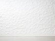 Close-up view of a textured white wall