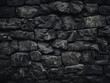 Black smears disrupt the backdrop of the rough stone wall