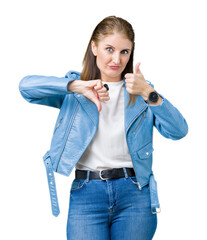 Poster - Beautiful middle age mature woman wearing fashion leather jacket over isolated background Doing thumbs up and down, disagreement and agreement expression. Crazy conflict